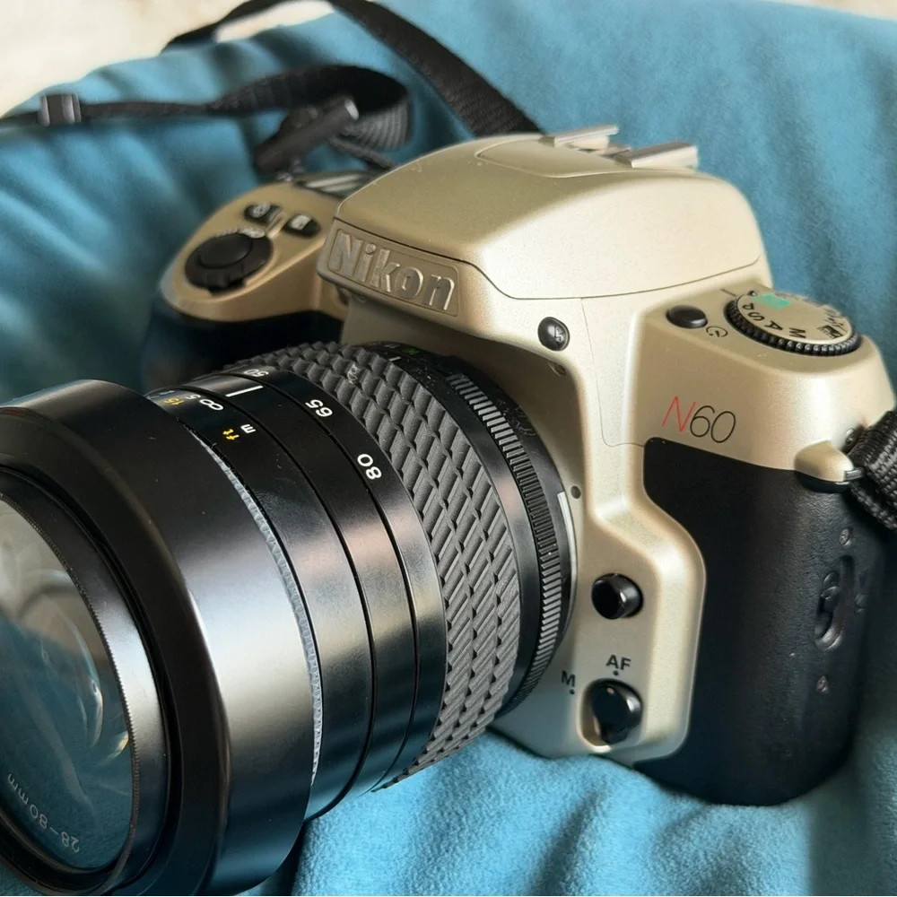 Nikon N60 35mm camera with Tokina 28-80mm lens plus carrying case & manual book